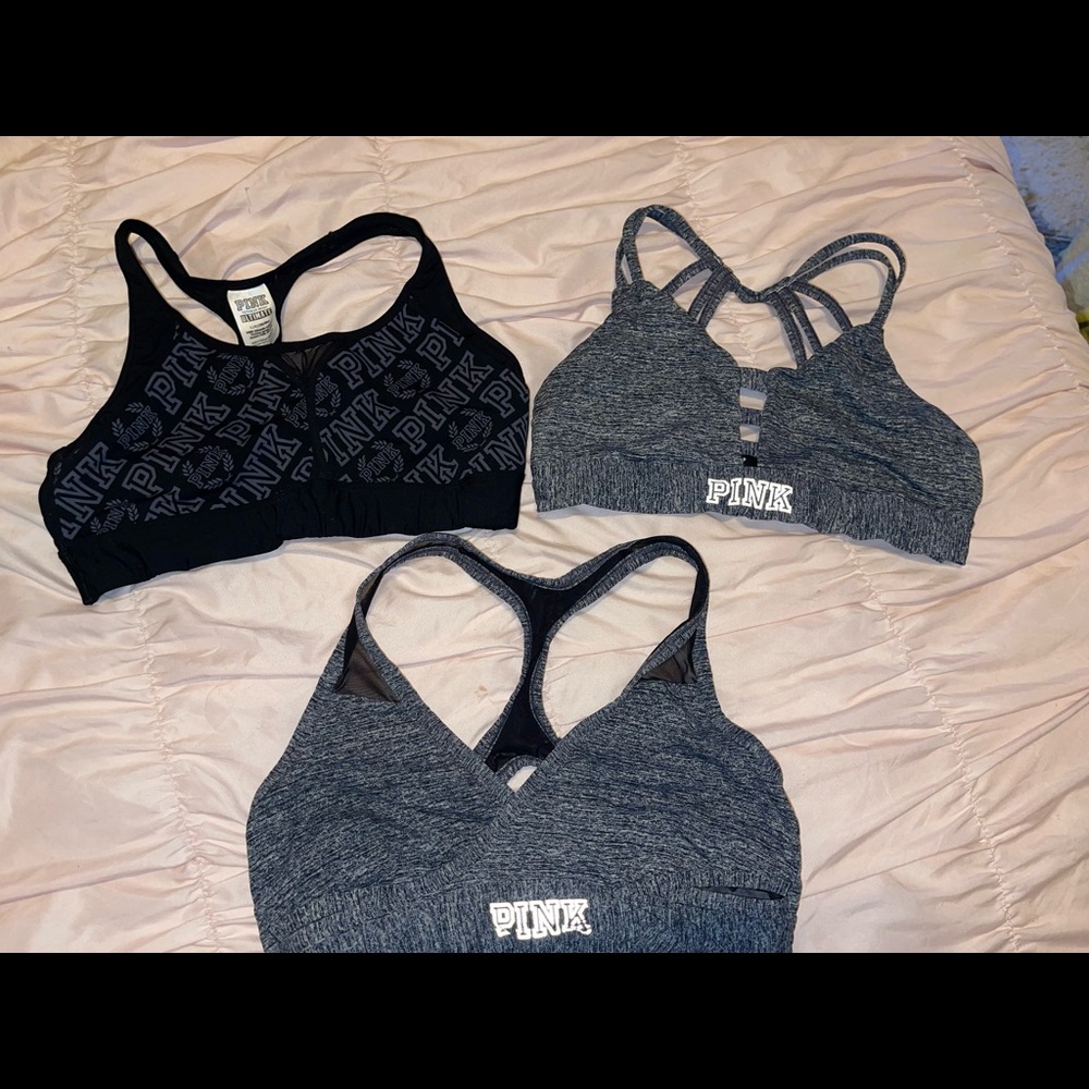 Three Victoria’s Secret pink sports bras